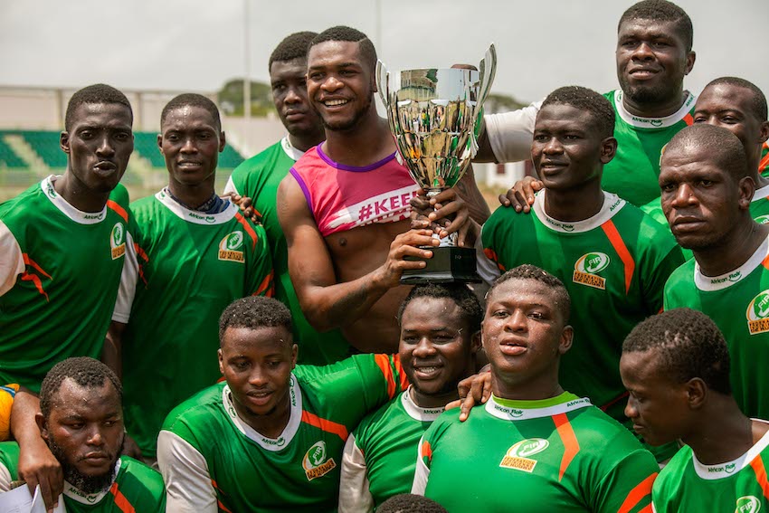 Ivory Coast team members displaying the Champion Trophy. with pridejpg